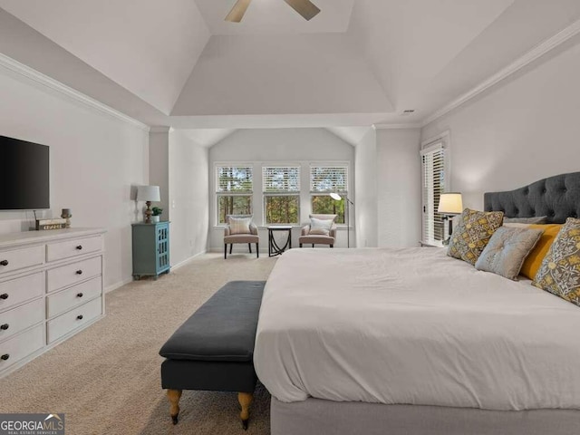 carpeted bedroom with ceiling fan, lofted ceiling, crown molding, and a tray ceiling