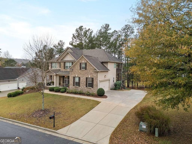 view of front of home with a garage and a front lawn