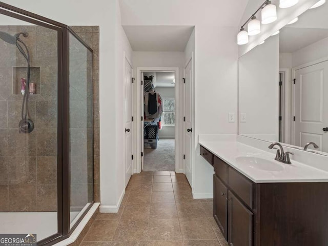 bathroom with vanity, tile patterned floors, and walk in shower