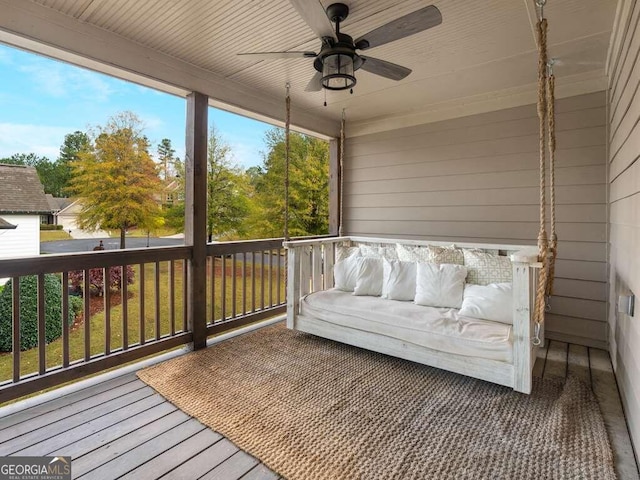 sunroom / solarium with ceiling fan