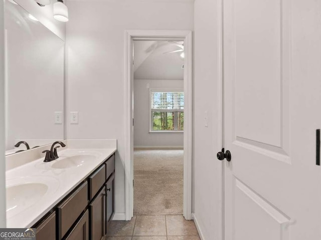 bathroom with tile patterned floors and vanity