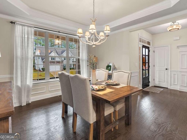 dining area with dark hardwood / wood-style flooring and ornamental molding