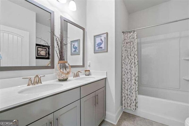 bathroom featuring tile patterned flooring, shower / tub combo, and vanity