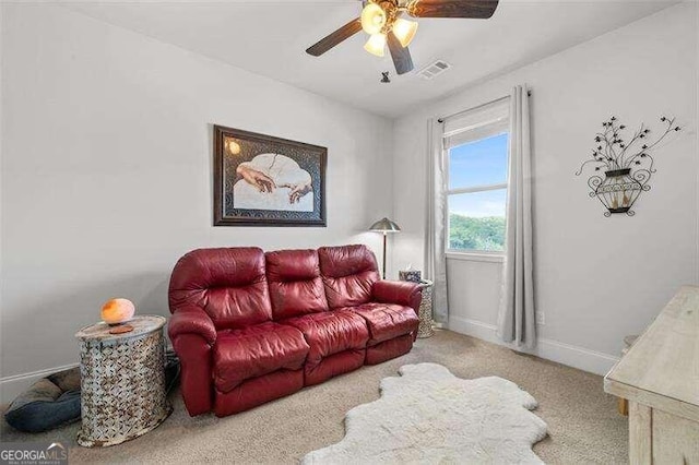 living room featuring light carpet and ceiling fan