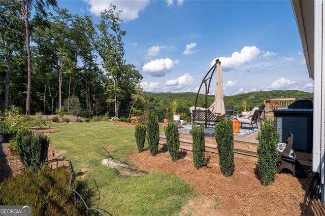 view of yard with a wooden deck