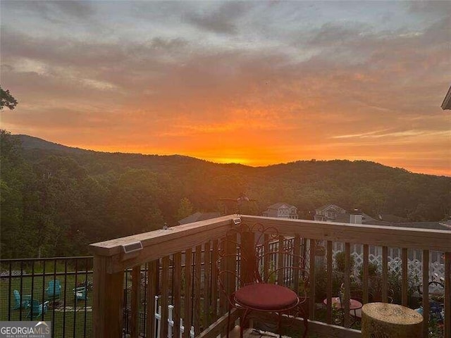 balcony at dusk with a mountain view