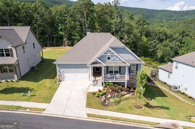 view of front of property with covered porch and a garage