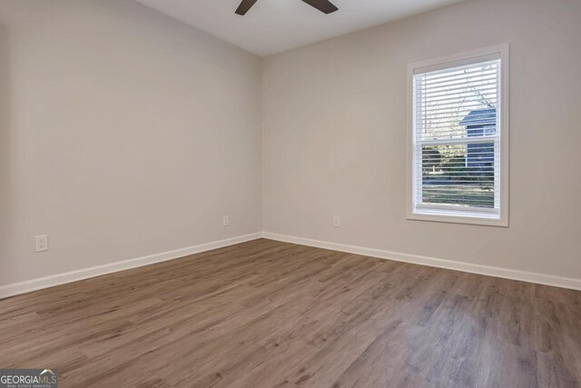 spare room featuring ceiling fan and wood-type flooring