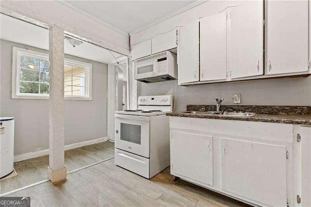 kitchen featuring light hardwood / wood-style floors, white cabinetry, white appliances, and sink