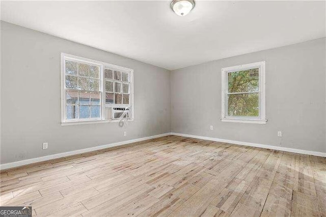 spare room featuring light hardwood / wood-style flooring