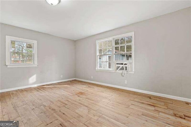 spare room featuring light wood-type flooring