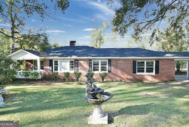 ranch-style home featuring a front yard