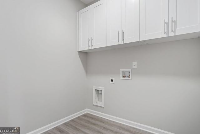 laundry room with cabinets, washer hookup, light wood-type flooring, and hookup for an electric dryer