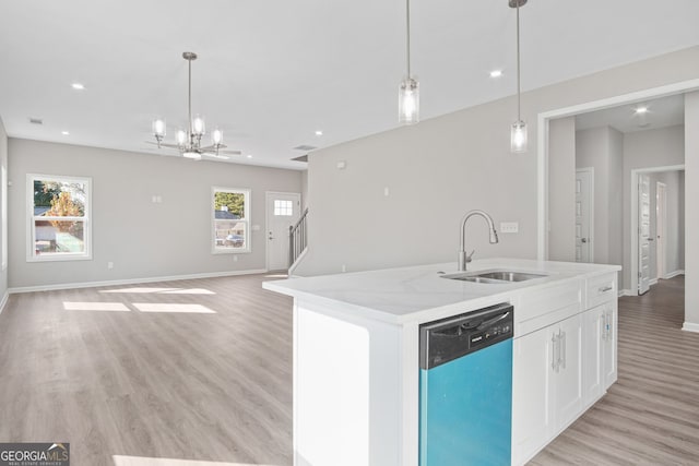 kitchen with white cabinets, stainless steel dishwasher, plenty of natural light, and sink