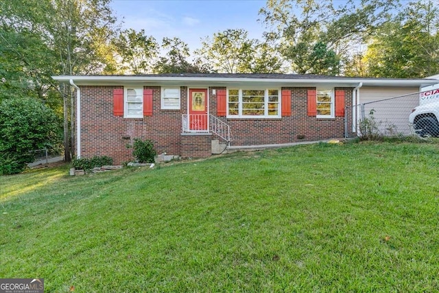 ranch-style house featuring a front lawn