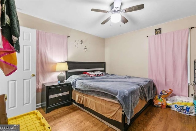 bedroom featuring ceiling fan and light wood-type flooring