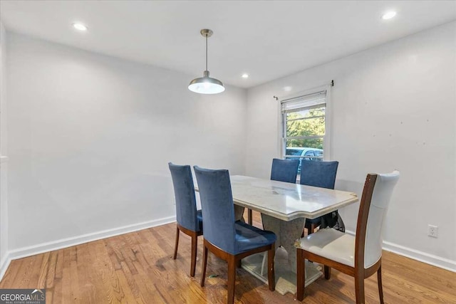 dining area with light hardwood / wood-style floors