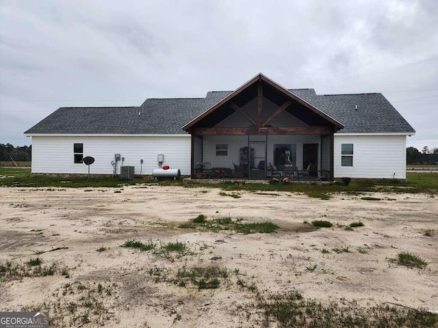 back of property featuring central AC unit