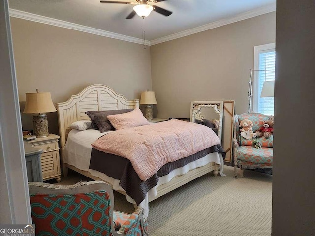 bedroom featuring ceiling fan, crown molding, and carpet