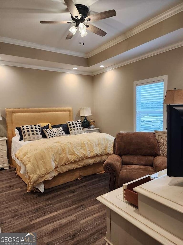 bedroom with ceiling fan, dark hardwood / wood-style flooring, and crown molding