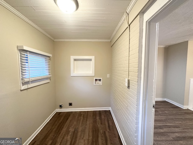 laundry room featuring electric dryer hookup, ornamental molding, dark wood-type flooring, and hookup for a washing machine