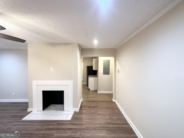 unfurnished living room with electric panel, hardwood / wood-style floors, a textured ceiling, and ornamental molding