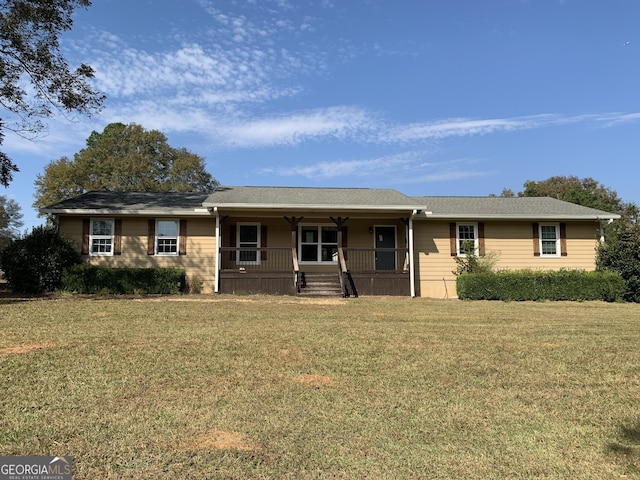 single story home featuring covered porch and a front yard