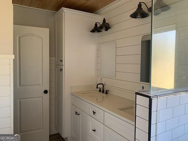 bathroom featuring vanity and wood ceiling