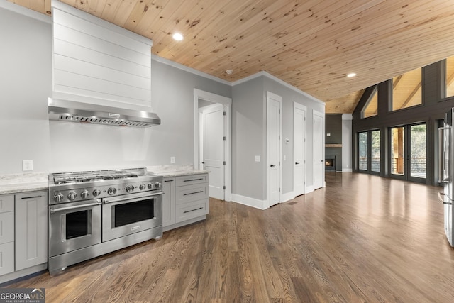 kitchen with a healthy amount of sunlight, high end appliances, light wood-type flooring, and wood ceiling