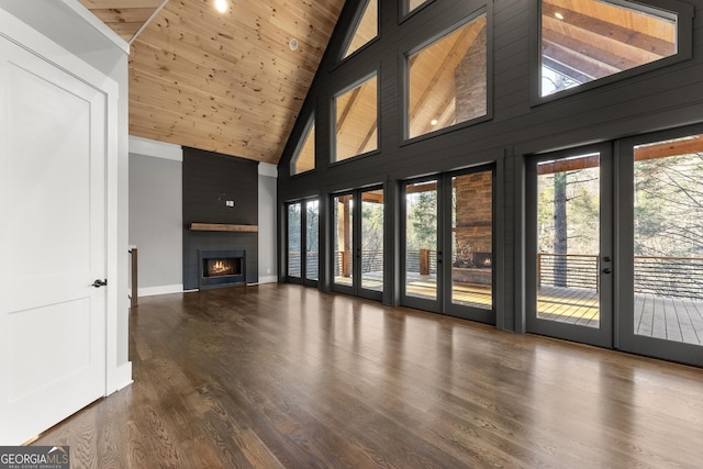 kitchen with gray cabinetry, light stone countertops, wooden ceiling, dark hardwood / wood-style flooring, and range with two ovens