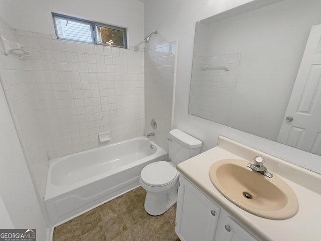 full bathroom featuring tile patterned flooring, vanity, toilet, and tiled shower / bath combo