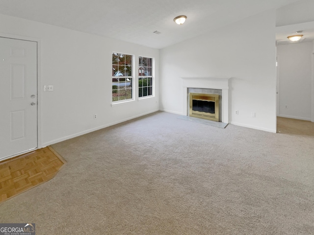 unfurnished living room featuring parquet flooring