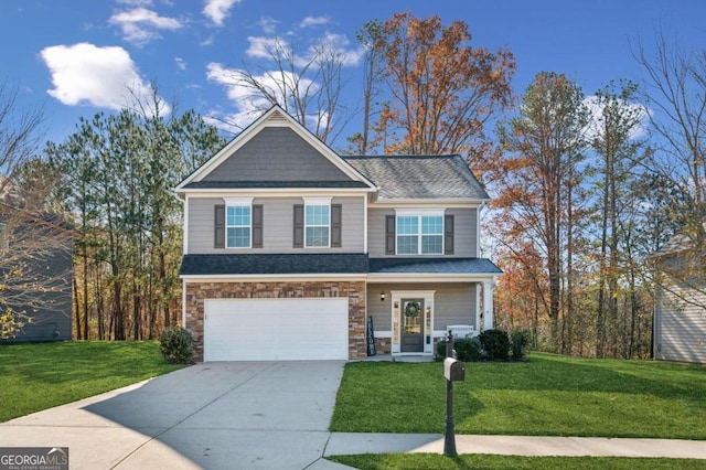 view of front facade with a front yard and a garage