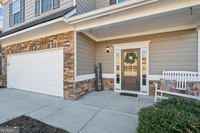 entrance to property featuring a garage