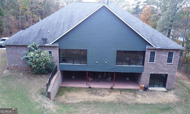 25 Fireside Ct NW, Cartersville, GA 30120 - rear view of property with a patio area, brick siding, and roof with shingles