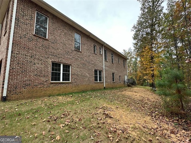 25 Fireside Ct NW, Cartersville, GA 30120 - view of side of property with brick siding and a lawn