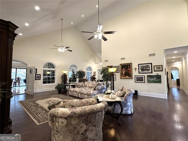 25 Fireside Ct NW, Cartersville, GA 30120 - living area featuring arched walkways, ceiling fan, high vaulted ceiling, healthy amount of natural light, and dark wood-style flooring