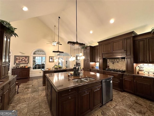 kitchen featuring dishwasher, high vaulted ceiling, sink, decorative light fixtures, and dark brown cabinetry