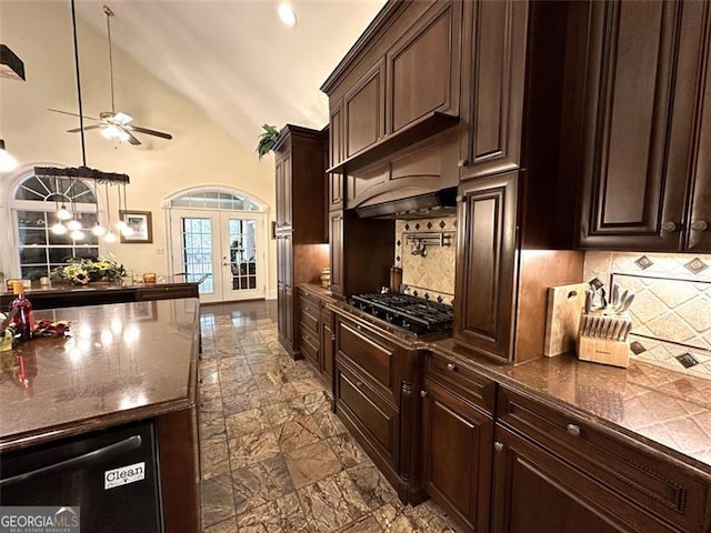 kitchen with backsplash, high vaulted ceiling, french doors, hanging light fixtures, and dark brown cabinets