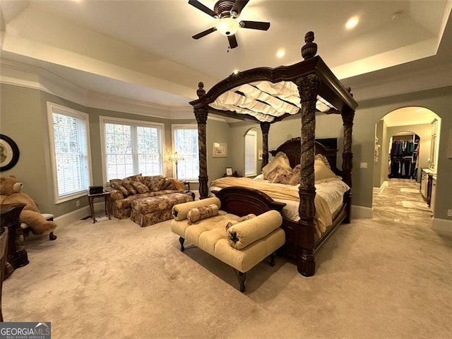 25 Fireside Ct NW, Cartersville, GA 30120 - bedroom featuring arched walkways, a tray ceiling, light colored carpet, ornamental molding, and recessed lighting