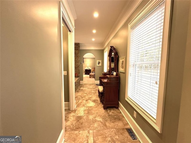 25 Fireside Ct NW, Cartersville, GA 30120 - corridor with arched walkways, crown molding, light stone finish floors, and recessed lighting