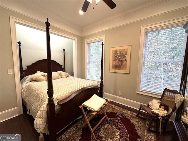 bedroom with ceiling fan, ornamental molding, and hardwood / wood-style flooring