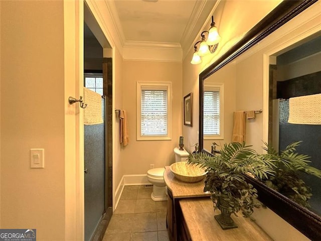 bathroom featuring vanity, tile patterned floors, toilet, ornamental molding, and an enclosed shower