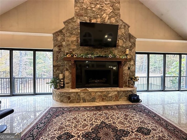 living room with crown molding, a fireplace, and high vaulted ceiling