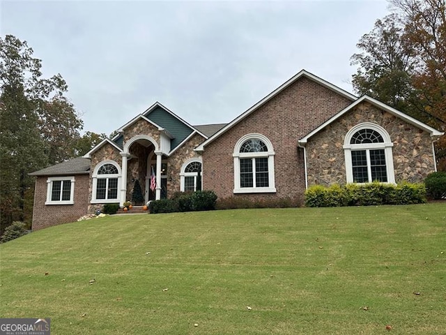 25 Fireside Ct NW, Cartersville, GA 30120 - view of front of property with a front yard, stone siding, and brick siding
