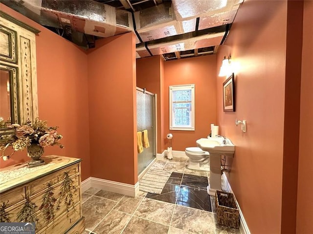 bathroom featuring walk in shower and toilet