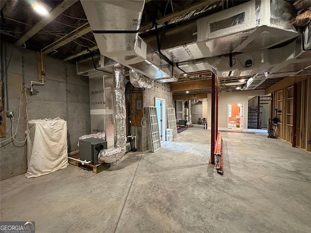 basement featuring heating unit