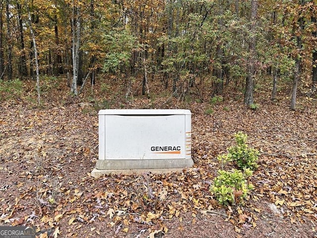 25 Fireside Ct NW, Cartersville, GA 30120 - exterior view of a power unit and a heavily wooded area