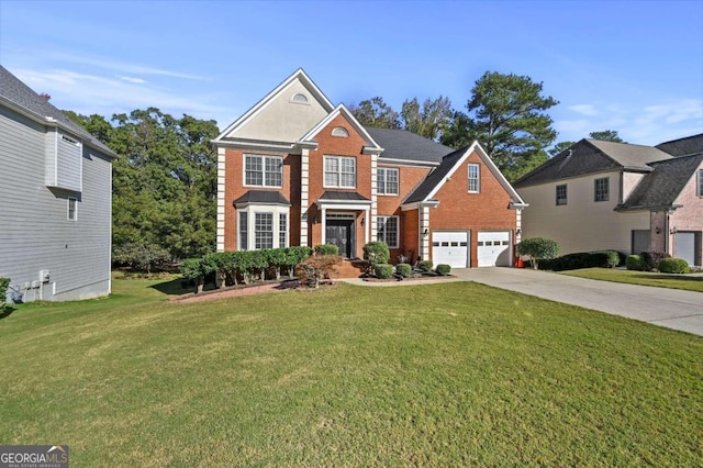 view of front of home featuring a garage and a front yard