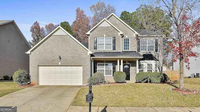 view of front property with central AC unit, a garage, and a front yard